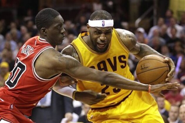 Cleveland Cavaliers forward LeBron James (23) drives against Chicago Bulls forward Tony Snell (20) during the second half of Game 2 in a second-round NBA basketball playoff series Wednesday, May 6, 2015, in Cleveland. The Cavaliers won 106-91. (AP Photo/Tony Dejak)