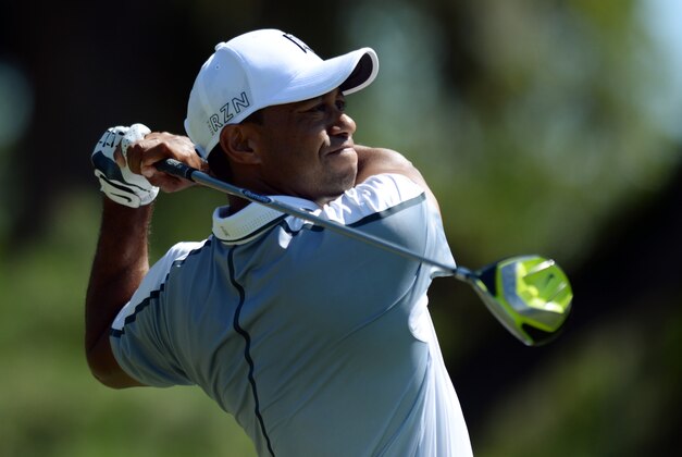 May 7, 2015; Ponte Vedra Beach, FL, USA; Tiger Woods hits his tee shot on the 9th hole during the first round of The Players Championship golf tournament at TPC Sawgrass - Stadium Course. Mandatory Credit: Jake Roth-USA TODAY Sports