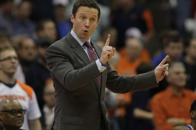 Louisiana Tech head coach Michael White signals to his players in the second half of an NCAA college basketball game against Syracuse in Syracuse, N.Y., Sunday, Dec. 14, 2014. Syracuse won 71-69. (AP Photo/Nick Lisi)