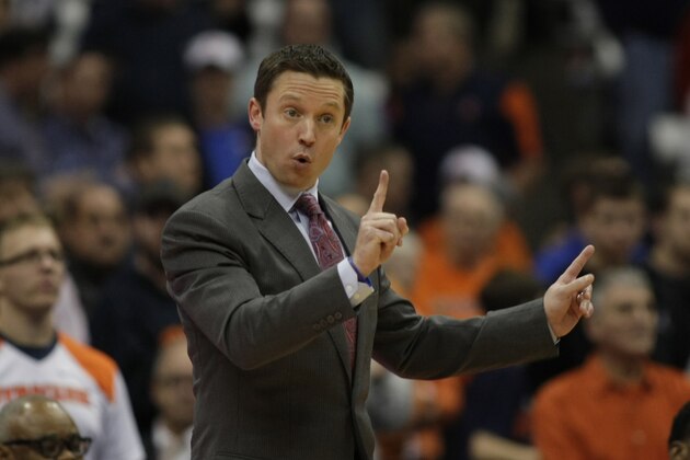 Louisiana Tech head coach Michael White signals to his players in the second half of an NCAA college basketball game against Syracuse in Syracuse, N.Y., Sunday, Dec. 14, 2014. Syracuse won 71-69. (AP Photo/Nick Lisi)