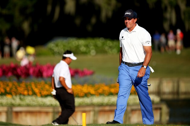 PONTE VEDRA BEACH, FL - MAY 07:  Phil Mickelson walks on the 17th green during round one of THE PLAYERS Championship at the TPC Sawgrass Stadium course on May 7, 2015 in Ponte Vedra Beach, Florida.  (Photo by Mike Ehrmann/Getty Images)