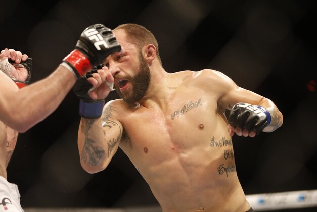Sam Sicilia, right, from the U.S., fights Rony Mariano Bezzerra, left, from Brazil,  during their featherweight mixed martial arts bout at the Ultimate Fighting Championship (UFC) 153 in Rio de Janeiro, Brazil, Saturday Oct.  13, 2012. Bezzerra defeated Sicilia. (AP Photo/Felipe Dana)