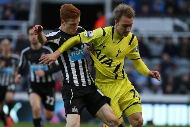 Newcastle United's Jack Colback, left, vies for the ball with Tottenham Hotspur's Christian Eriksen, right, during their English Premier League soccer match between Newcastle United and Tottenham Hotspur at St James' Park, Newcastle, England, Sunday, April, 19, 2015. (AP Photo/Scott Heppell)