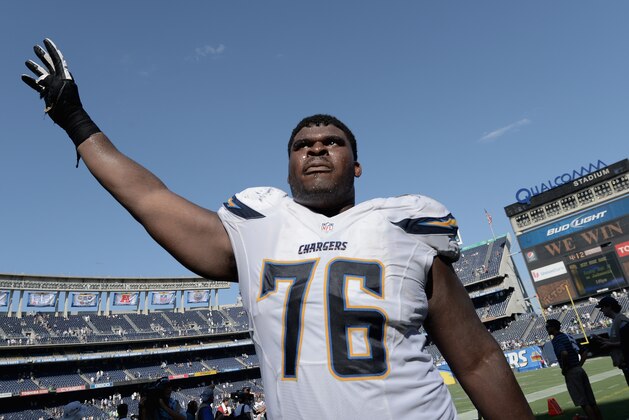 SAN DIEGO, CA - SEPTEMBER 14:  Offensive tackle D.J. Fluker #76 of the San Diego Chargers waves to the fans after defeating the Seattle Seahawks 30-21 at Qualcomm Stadium on September 14, 2014 in San Diego, California.  (Photo by Donald Miralle/Getty Images)