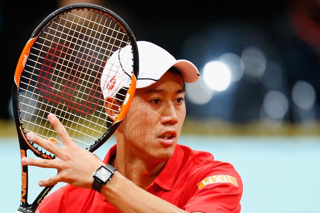 MADRID, SPAIN - MAY 06:  Kei Nishikori of Japan in action against David Goffin of Belgium during day five of the Mutua Madrid Open tennis tournament at the Caja Magica on May 6, 2015 in Madrid, Spain.  (Photo by Julian Finney/Getty Images)
