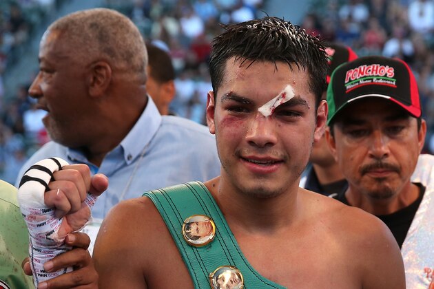 LOS ANGELES, CA - AUGUST 16:  Omar Figueroa Jr. poses with his belt after defeating Daniel Estrada in their WBC Lightweight World Championship fight at StubHub Center on August 16, 2014 in Los Angeles, California.  (Photo by Stephen Dunn/Getty Images)