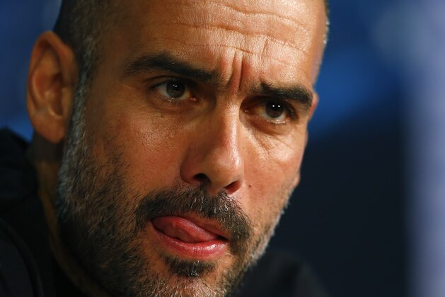 Bayern's head coach Pep Guardiola from Spain listens to questions of journalists during a news conference prior to the Champions League quarterfinal second leg soccer match between FC Bayern Munich and FC Porto at Allianz Arena in Munich, southern Germany, Monday, April 20, 2015. Munich will face Porto Tuesday. (AP Photo/Matthias Schrader)