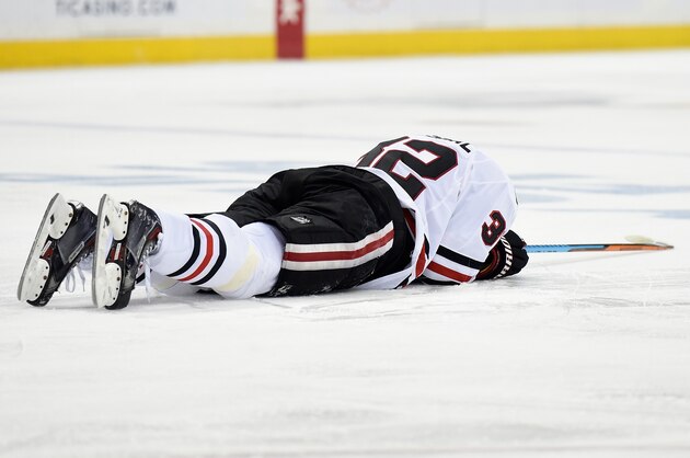 ST PAUL, MN - MAY 7: Michal Rozsival #32 of the Chicago Blackhawks lays on the ice after an injury during the second period in Game Four of the Western Conference Semifinals against the Minnesota Wild during the 2015 NHL Stanley Cup Playoffs on May 7, 2015 at Xcel Energy Center in St Paul, Minnesota. (Photo by Hannah Foslien/Getty Images)
