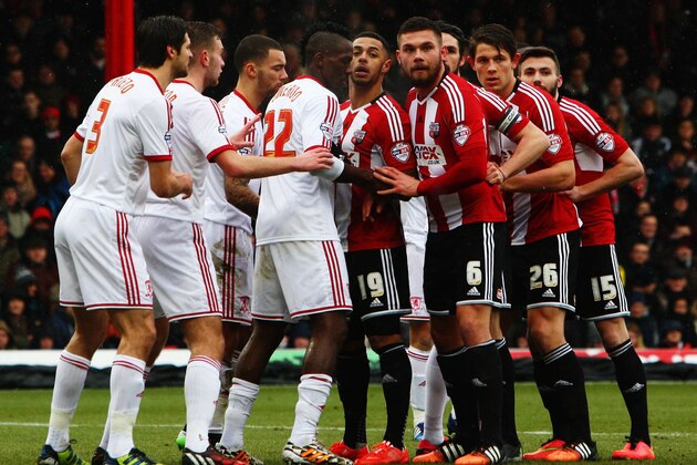 BRENTFORD, ENGLAND - JANUARY 31:  Players from both teams line up to challenge for the ball at a free kick during the Sky Bet Championship match between Brentford and Middlesbrough at Griffin Park on January 31, 2015 in Brentford, England.  (Photo by Ker Robertson/Getty Images)