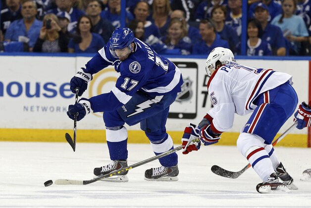 TAMPA, FL - MAY 7: P.A. Parenteau #15 of the Montreal Canadiens checks Alex Killorn #17 of the Tampa Bay Lightning in Game Four of the Eastern Conference Semifinals during the 2015 NHL Stanley Cup Playoffs at Amalie Arena on May 7, 2015 in Tampa, Florida. (Photo by Mike Carlson/Getty Images)