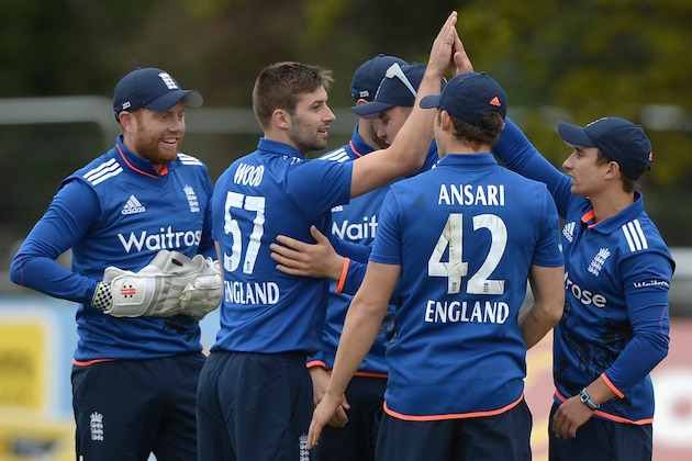MALAHIDE, IRELAND - MAY 08:  Mark Wood of England celebrates with teammates after bowling Ireland captain William Porterfieldduring the Royal London One Day International between Ireland and England at Malahide Cricket Club on May 8, 2015 in Malahide, Ireland.  (Photo by Gareth Copley/Getty Images)
