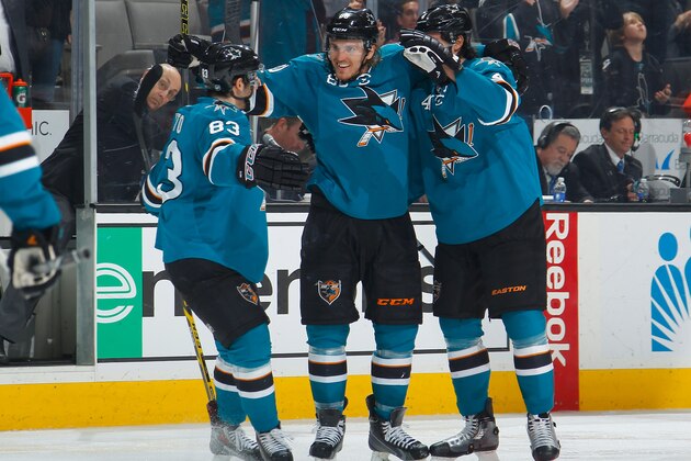SAN JOSE, CA - FEBRUARY 2: Matt Nieto #83, Matt Tennyson #80 and Brenden Dillon #4 of the San Jose Sharks celebrate after Tennyson's goal against the Edmonton Oilers during an NHL game on February 2, 2015 at SAP Center in San Jose, California. (Photo by Don Smith/NHLI via Getty Images)