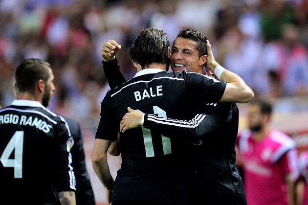 SEVILLE, SPAIN - MAY 02:  Cristiano Ronaldo of Real Madrid celebrates with Gareth Bale after scoring his team's 2nd goal during the La Liga match between Sevilla FC and Real Madrid CF at Estadio Ramon Sanchez Pizjuan on May 2, 2015 in Seville, Spain.  (Photo by Denis Doyle/Getty Images)