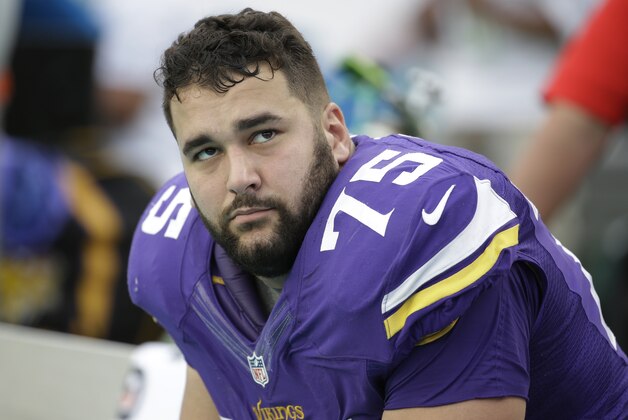 Minnesota Vikings tackle Matt Kalil (75) looks up from the sidelines during the second half of an NFL football game against the Miami Dolphins, Sunday, Dec. 21, 2014, in Miami Gardens, Fla. The Dolphins defeated the Vikings 37-35.  (AP Photo/Lynne Sladky)