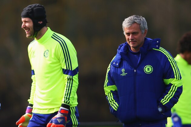 COBHAM, ENGLAND - MARCH 10:  Jose Mourinho manager of Chelsea (R) and goalkeeper Petr Cech (2R) smile during a Chelsea training session ahead of the UEFA Champions League Round of 16 second leg match against Paris Saint-Germain at Chelsea Training Ground on March 10, 2015 in Cobham, England.  (Photo by Paul Gilham/Getty Images)