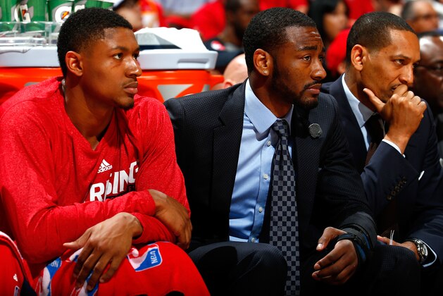 ATLANTA, GA - MAY 05:  John Wall #2 of the Washington Wizards sits on the bench with Bradley Beal #3 during Game Two of the Eastern Conference Semifinals of the 2015 NBA Playoffs against the Atlanta Hawks at Philips Arena on May 5, 2015 in Atlanta, Georgia.  NOTE TO USER: User expressly acknowledges and agrees that, by downloading and/or using this photograph, user is consenting to the terms and conditions of the Getty Images License Agreement.  (Photo by Kevin C. Cox/Getty Images)