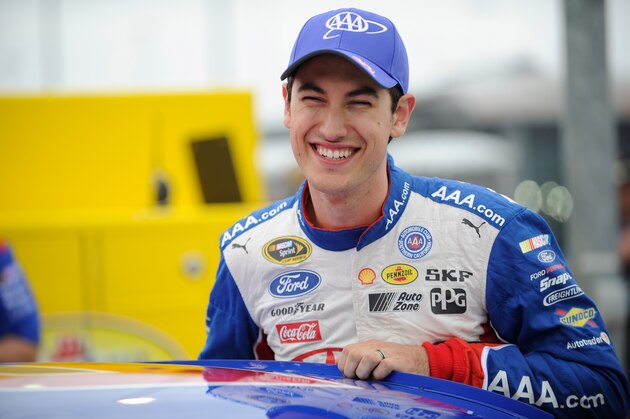 KANSAS CITY, KS - MAY 08:  Joey Logano, driver of the #22 AAA Insurance Ford, gets in his car on the grid during qualifying for the NASCAR Sprint Cup Series SpongeBob SquarePants 400 at Kansas Speedway on May 8, 2015 in Kansas City, Kansas.  (Photo by Ed Zurga/Getty Images)