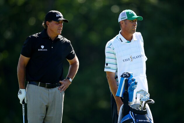 PONTE VEDRA BEACH, FL - MAY 08:  Phil Mickelson and caddie Jim 'Bones' Mackay prepare to play his second shot on the 14th hole during round two of THE PLAYERS Championship at the TPC Sawgrass Stadium course on May 8, 2015 in Ponte Vedra Beach, Florida.  (Photo by Richard Heathcote/Getty Images)