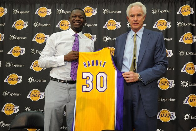 EL SEGUNDO, CA - JUNE 30:  Julius Randle #30 of the Los Angeles Lakers poses for a photo with Los Angeles Lakers General Manager Mitch Kupchak during his introductory press conference on June 30, 2014 at the Toyota Sports Center in El Segundo, California.  NOTE TO USER: User expressly acknowledges and agrees that, by downloading and or using this photograph, User is consenting to the terms and conditions of the Getty Images License Agreement. Mandatory Copyright Notice: Copyright 2014 NBAE  (Photo by Andrew D. Bernstein/NBAE via Getty Images)