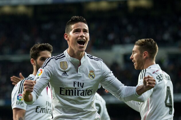 MADRID, SPAIN - APRIL 18:  James Rodriguez (L) of Real Madrid CF celebrates scoring their second goal with teammate Sergio Ramos (R) during the La Liga match between Real Madrid CF and Malaga CF at Estadio Santiago Bernabeu on April 18, 2015 in Madrid, Spain.  (Photo by Gonzalo Arroyo Moreno/Getty Images)