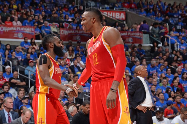 LOS ANGELES, CA - MAY 8:  James Harden #13 shakes hands with Dwight Howard #12 of the Houston Rockets in Game Three of the Western Conference Semifinals against the Los Angeles Clippers during the 2015 NBA Playoffs on May 8, 2015 at STAPLES Center in Los Angeles, California. NOTE TO USER: User expressly acknowledges and agrees that, by downloading and/or using this Photograph, user is consenting to the terms and conditions of the Getty Images License Agreement. Mandatory Copyright Notice: Copyright 2015 NBAE (Photo by Andrew D. Bernstein/NBAE via Getty Images)