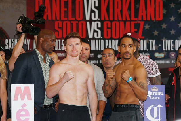 HOUSTON, TX - MAY 08:  Canelo Alvarez of Mexico and James Kirkland pose on stage alongside promotors Bernard Hopkins and 50 Cent inside the Union Station lobby after their weigh-in inside prior to their super welterweight bout tomorrow at Minute Maid Park on May 8, 2015 in Houston, Texas.  (Photo by Scott Halleran/Getty Images)