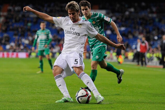 MADRID, SPAIN - DECEMBER 02:  Fabio Coentrao of Real Madrid crosses the ball during the Copa Del Rey Round of 32, Second Leg match between Real Madrid CF and Cornella at Santiago Bernabeu stadium on December 2, 2014 in Madrid, Spain.  (Photo by Denis Doyle/Getty Images)