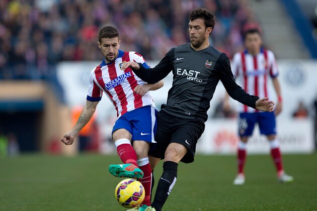MADRID, SPAIN - JANUARY 03: Gabi Fernandez (L) of Atletico de Madrid competes for the ball with Nabil El Zhar of Levante UD (R) during the La Liga match between Club Atletico de Madrid and Levante UD at Vicente Calderon Stadium on January 3, 2015 in Madrid, Spain.  (Photo by Gonzalo Arroyo Moreno/Getty Images)