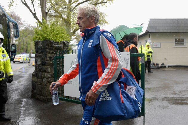 MALAHIDE, IRELAND - MAY 08:  England coach Peter Moores leaves the ground after the Royal London One Day International between Ireland and England is abandoned at Malahide Cricket Club on May 8, 2015 in Malahide, Ireland.  (Photo by Gareth Copley/Getty Images)