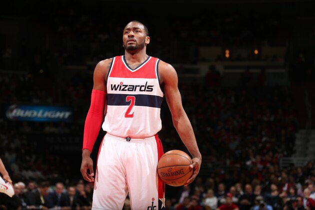 WASHINGTON, DC -  APRIL 24:  John Wall #2 of the Washington Wizards shoots a free throw against the Toronto Raptors in Game Three of the Eastern Conference Quarterfinals during the 2015 NBA Playoffs on April 24, 2015 at Verizon Center in Washington, DC. NOTE TO USER: User expressly acknowledges and agrees that, by downloading and or using this Photograph, user is consenting to the terms and conditions of the Getty Images License Agreement. Mandatory Copyright Notice: Copyright 2015 NBAE (Photo by Ned Dishman/NBAE via Getty Images)