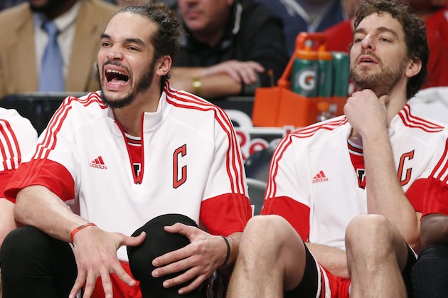 Chicago Bulls center Joakim Noah, left, and forward Pau Gasol (16) react as they watch from the bench in the waning minutes of an NBA basketball game against the Brooklyn Nets at the Barclays Center, Sunday, Nov. 30, 2014, in New York. The Bulls defeated the Nets 102-84. (AP Photo/Kathy Willens)