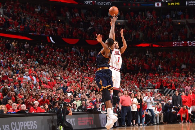 CHICAGO,IL : Derrick Rose #1 of the Chicago Bulls hits the game winning three pointer with three seconds left in the game against the Cleveland Cavaliers at the United Center During Game Two of the Eastern Conference Semifinals during the 2015 NBA Playoffs on May 8, 2015 in Chicago,Illinois NOTE TO USER: User expressly acknowledges and agrees that, by downloading and/or using this Photograph, user is consenting to the terms and conditions of the Getty Images License Agreement. Mandatory Copyright Notice: Copyright 2015 NBAE (Photo by Jesse D. Garrabrant/NBAE via Getty Images)