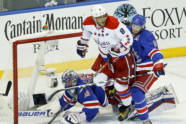 Washington Capitals left wing Alex Ovechkin (8) watches the rebound on a shot attempt against New York Rangers goalie Henrik Lundqvist (30) and New York Rangers defenseman Dan Girardi (5) during the first period of Game 5 in the second round of the NHL Stanley Cup hockey playoffs, Friday, May 8, 2015, in New York. (AP Photo/Julie Jacobson)