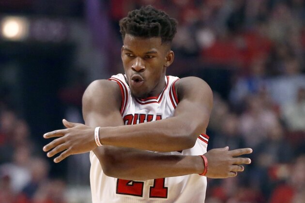 Chicago Bulls guard Jimmy Butler (21) reacts after making a three-point shot during the first half in Game 5 of the NBA basketball playoffs against the Milwaukee Bucks Monday, April 27, 2015, in Chicago. (AP Photo/Charles Rex Arbogast)