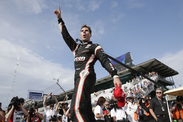 Will Power, of Australia, celebrates after winning the Grand Prix of Indianapolis auto race at the Indianapolis Motor Speedway in Indianapolis, Saturday, May 9, 2015.  (AP Photo/AJ Mast)