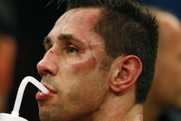 IBF middleweight champion Felix Sturm of Germany drinks after losing his IBF middleweight title bout against Australian challenger Sam Soliman in Krefeld, Germany, Sunday, June 1, 2014.  Soliman won the IBF middleweight title with a unanimous decision over Sturm.  (AP Photo/Frank Augstein)