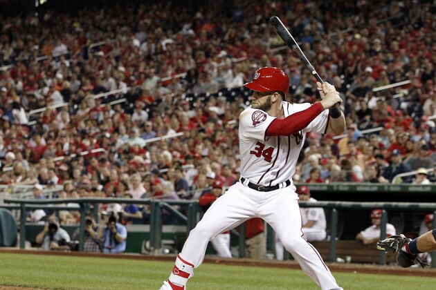 Washington Nationals right fielder Bryce Harper (34) prepares to hit a home run while not wearing batting gloves during a baseball game against the Atlanta Braves at Nationals Park, Friday, May 8, 2015, in Washington. (AP Photo/Alex Brandon)