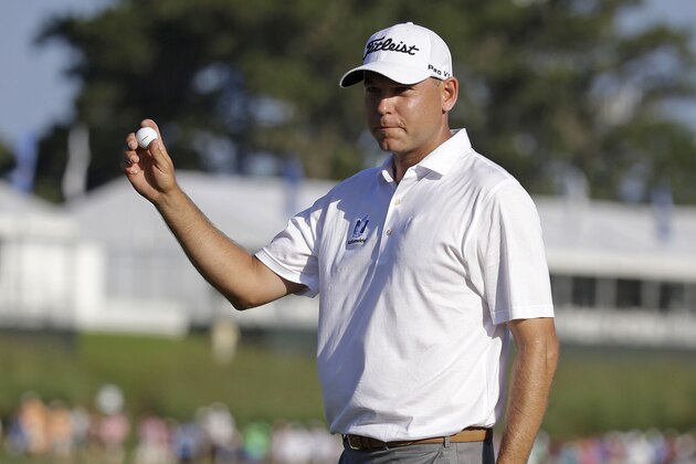 Bill Haas shows his ball after making par on the 18 hole during the third round of The Players Championship golf tournament Saturday, May 9, 2015, in Ponte Vedra Beach, Fla. (AP Photo/Lynne Sladky)