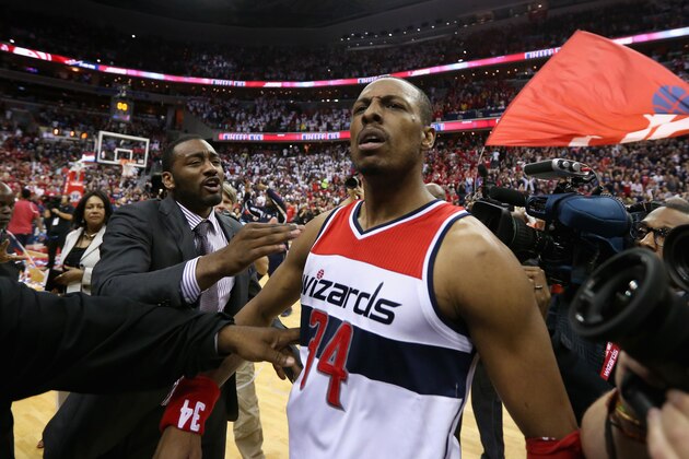 WASHINGTON, DC - MAY 09:  Paul Pierce #34 of the Washington Wizards celebrates with John Wall #2 (L) after hitting the game winning shot to give the Wizards a 103-101 win over the Atlanta Hawks in Game Three of the Eastern Conference Semifinals of the 2015 NBA Playoffs at Verizon Center on May 9, 2015 in Washington, DC. NOTE TO USER: User expressly acknowledges and agrees that, by downloading and or using this photograph, User is consenting to the terms and conditions of the Getty Images License Agreement.  (Photo by Rob Carr/Getty Images)
