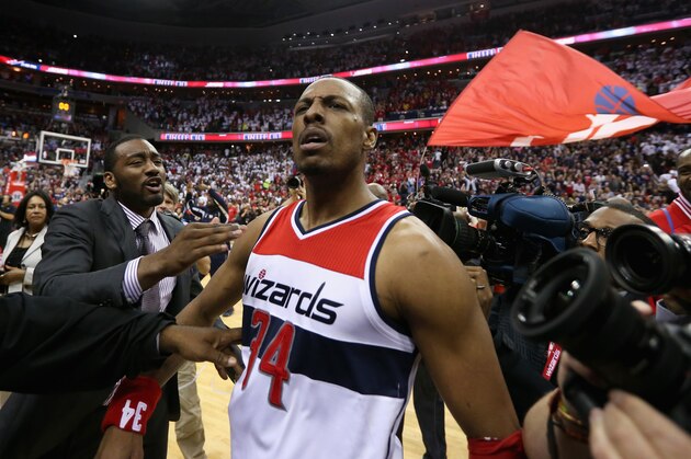 WASHINGTON, DC - MAY 09:  Paul Pierce #34 of the Washington Wizards celebrates with John Wall #2 (L) after hitting the game winning shot to give the Wizards a 103-101 win over the Atlanta Hawks in Game Three of the Eastern Conference Semifinals of the 2015 NBA Playoffs at Verizon Center on May 9, 2015 in Washington, DC. NOTE TO USER: User expressly acknowledges and agrees that, by downloading and or using this photograph, User is consenting to the terms and conditions of the Getty Images License Agreement.  (Photo by Rob Carr/Getty Images)