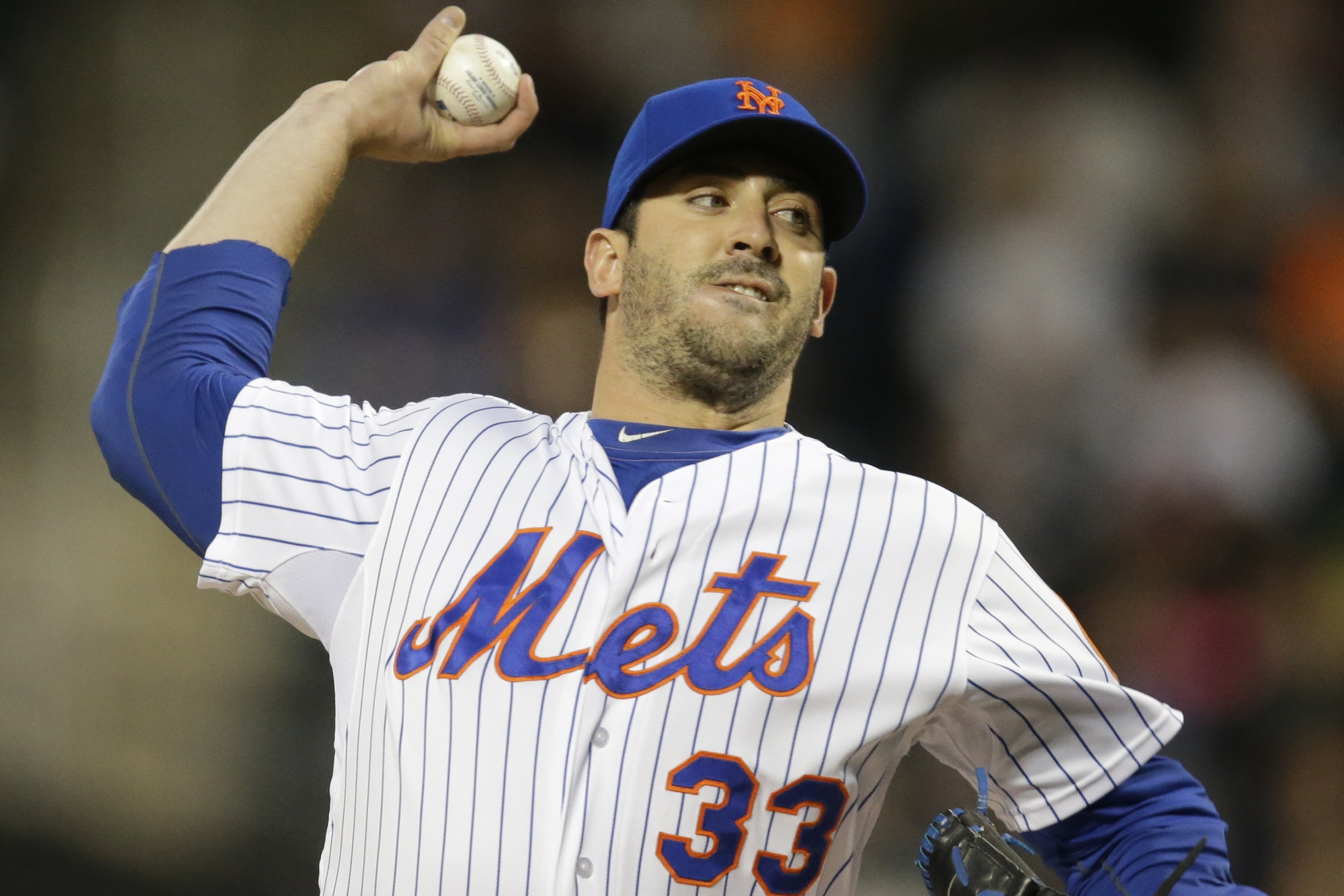 New York Mets starting pitcher Matt Harvey (33) delivers in the first inning of a baseball game against the Philadelphia Phillies in New York, Tuesday, April 14, 2015. (AP Photo/Kathy Willens)