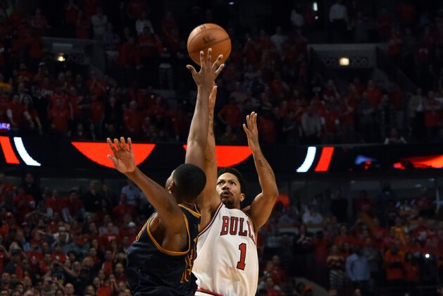 May 8, 2015; Chicago, IL, USA;  Chicago Bulls guard Derrick Rose (1) makes the game winning shot as he is defended by Cleveland Cavaliers center Tristan Thompson (13) during the second half in game three of the second round of the NBA Playoffs. at the United Center. The Chicago Bulls defeated the Cleveland Cavaliers 99-96. Mandatory Credit: David Banks-USA TODAY Sports