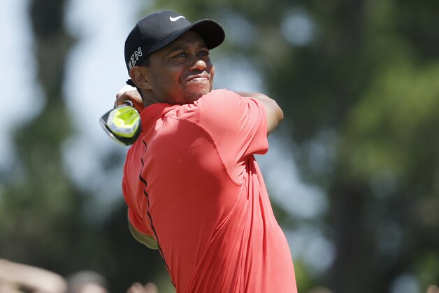 Tiger Woods hits from the 16 tee during the final round of The Players Championship golf tournament Sunday, May 10, 2015, in Ponte Vedra Beach, Fla. (AP Photo/Lynne Sladky)