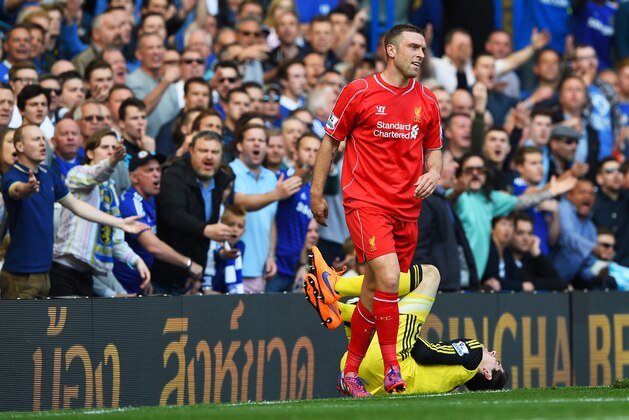 LONDON, ENGLAND - MAY 10:  Rickie Lambert of Liverpool is haranged by the chelsea fans after colliding with Thibaut Courtois of Chelsea during the Barclays Premier League match between Chelsea and Liverpool at Stamford Bridge on May 10, 2015 in London, England.  (Photo by Shaun Botterill/Getty Images)