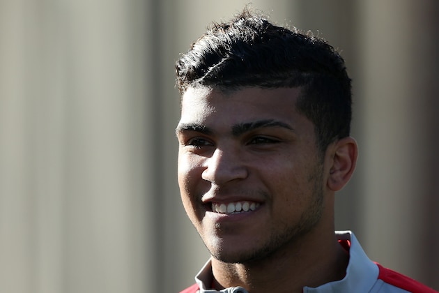 BOSTON, MA - OCTOBER 08:  DeAndre Yedlin enters a United States soccer training session at Ohiri Field on October 8, 2014 in Boston, Massachusetts.  (Photo by Mike Lawrie/Getty Images)