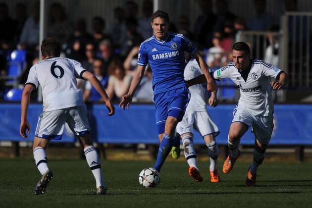 GUILDFORD, ENGLAND - MARCH 16: Andreas Christensen of Chelsea takes on the FC Schalke 04 defence during the UEFA Youth League Quarter Final match between Chelsea and FC Schalke 04 at the Chelsea Cobham training ground on March 16, 2014 in Guildford, England.  (Photo by Steve Bardens/Getty Images)