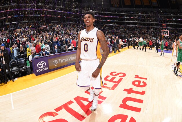 LOS ANGELES, CA - FEBRUARY 22:  Nick Young #0 of the Los Angeles Lakers celebrates after the game against the Boston Celtics on February 22, 2015 at Staples Center in Los Angeles, California. NOTE TO USER: User expressly acknowledges and agrees that, by downloading and or using this Photograph, user is consenting to the terms and conditions of the Getty Images License Agreement. Mandatory Copyright Notice: Copyright 2015 NBAE (Photo by Andrew D. Bernstein/NBAE via Getty Images)