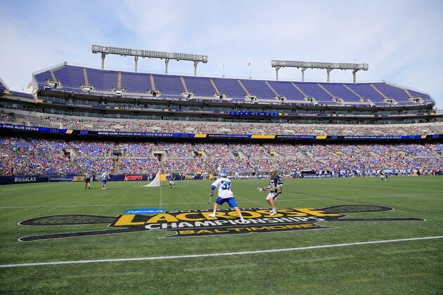 BALTIMORE, MD - MAY 26: Casey Carroll #37 of the Duke Blue Devils looks to pass around Conor Doyle #28 of the Notre Dame Fighting Irish during the second half of the 2014 NCAA Division I Men's Lacrosse Championship at M&T Bank Stadium on May 26, 2014 in Baltimore, Maryland.  (Photo by Rob Carr/Getty Images)