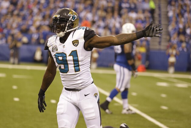 Jacksonville Jaguars defensive end Chris Clemons (91) celebrates after a fumble recovery by Chris Smith during the first half of an NFL football game against the Indianapolis Colts Sunday, Nov. 23, 2014 in Indianapolis. (AP Photo/Michael Conroy)