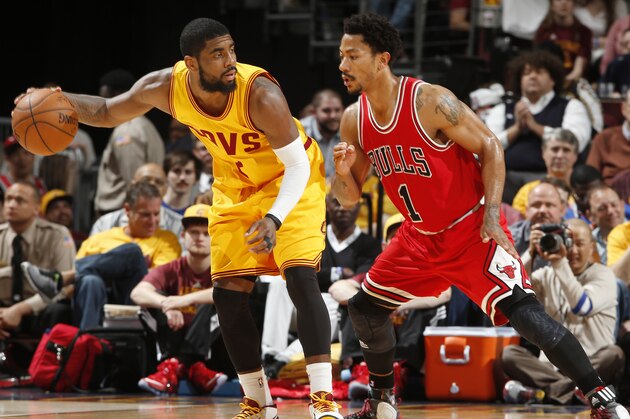 CLEVELAND, OHIO - MAY 6: Kyrie Irving #2 of the Cleveland Cavaliers looks to move the ball against Derrick Rose #1 of the Chicago Bulls during Game Two of the Eastern Conference Semifinals during the NBA Playoffs on May 6, 2015 at Quicken Loans Arena in Cleveland, Ohio.  NOTE TO USER: User expressly acknowledges and agrees that, by downloading and or using this Photograph, user is consenting to the terms and conditions of the Getty Images License Agreement.  Mandatory Copyright Notice: Copyright 2015 NBAE (Photo by Greg Shamus/NBAE via Getty Images)